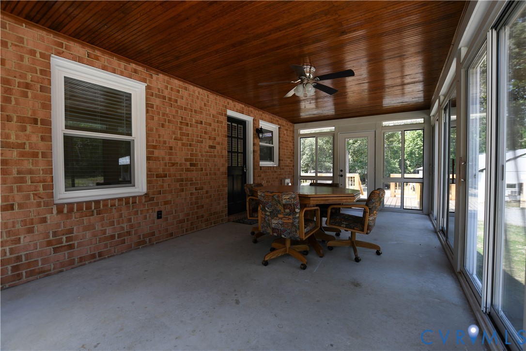 1448 Canterbury Road St. Stephens Church, VA 23148 - Photo 38 of 57 Enclosed sunroom featuring a brick wall, wood-pane
