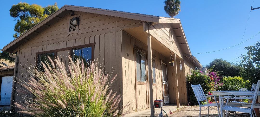 a view of balcony with furniture