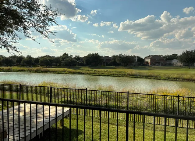 a view of a lake from a balcony