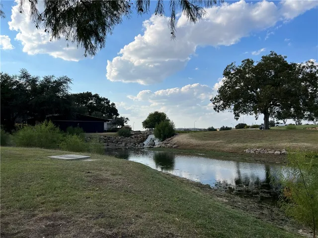 a view of a lake with outdoor space