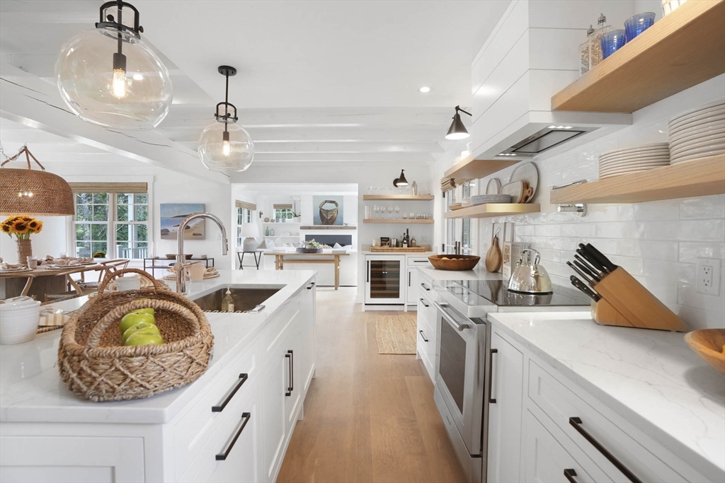 37 Rd To The Plaines Edgartown, MA 02539 - Photo 15 of 42 a kitchen with stainless steel appliances granite countertop a sink a stove and a wooden floors