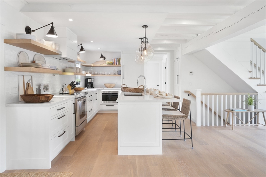 37 Rd To The Plaines Edgartown, MA 02539 - Photo 16 of 42 a kitchen with cabinets and chairs