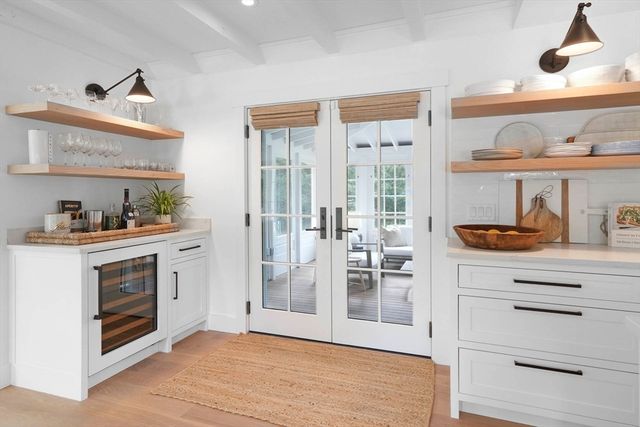 a view of kitchen cabinets and wooden floor