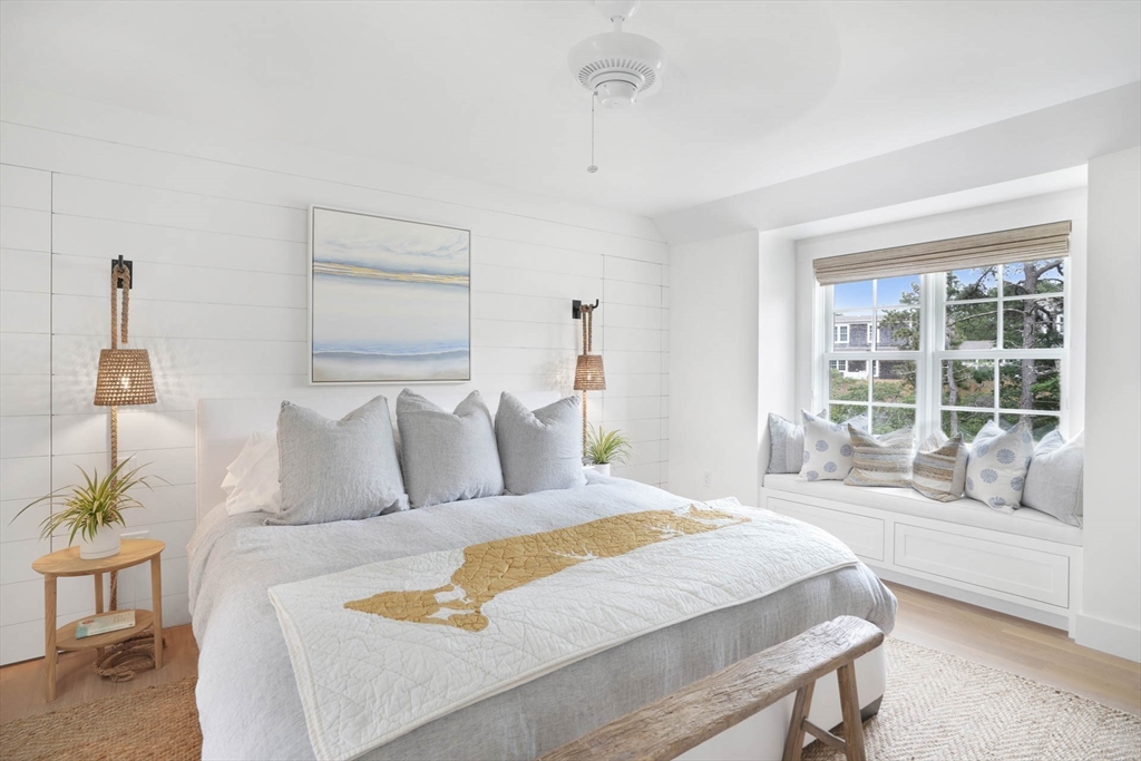 37 Rd To The Plaines Edgartown, MA 02539 - Photo 21 of 42 a bedroom with a large bed and a large window