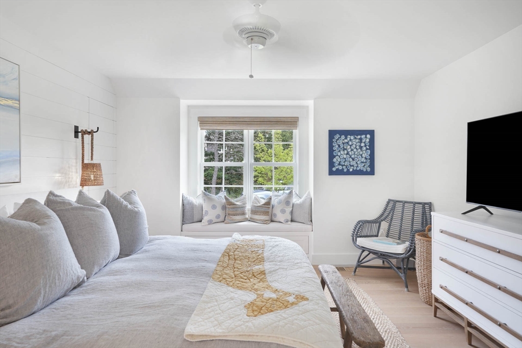 37 Rd To The Plaines Edgartown, MA 02539 - Photo 22 of 42 a living room with furniture and a flat screen tv
