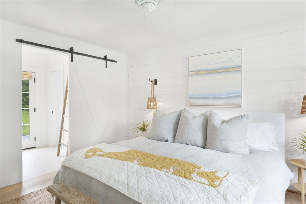 37 Rd To The Plaines Edgartown, MA 02539 - Photo 23 of 42 a bedroom with a bed and a window