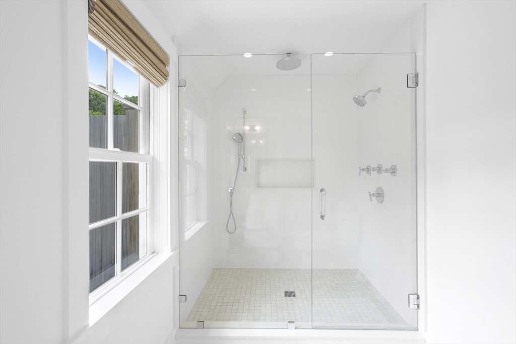 37 Rd To The Plaines Edgartown, MA 02539 - Photo 27 of 42 a bathroom with a glass shower door