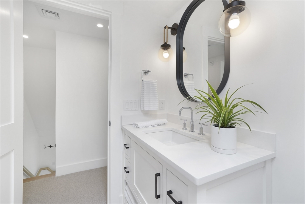 37 Rd To The Plaines Edgartown, MA 02539 - Photo 32 of 42 a bathroom with a sink and a mirror