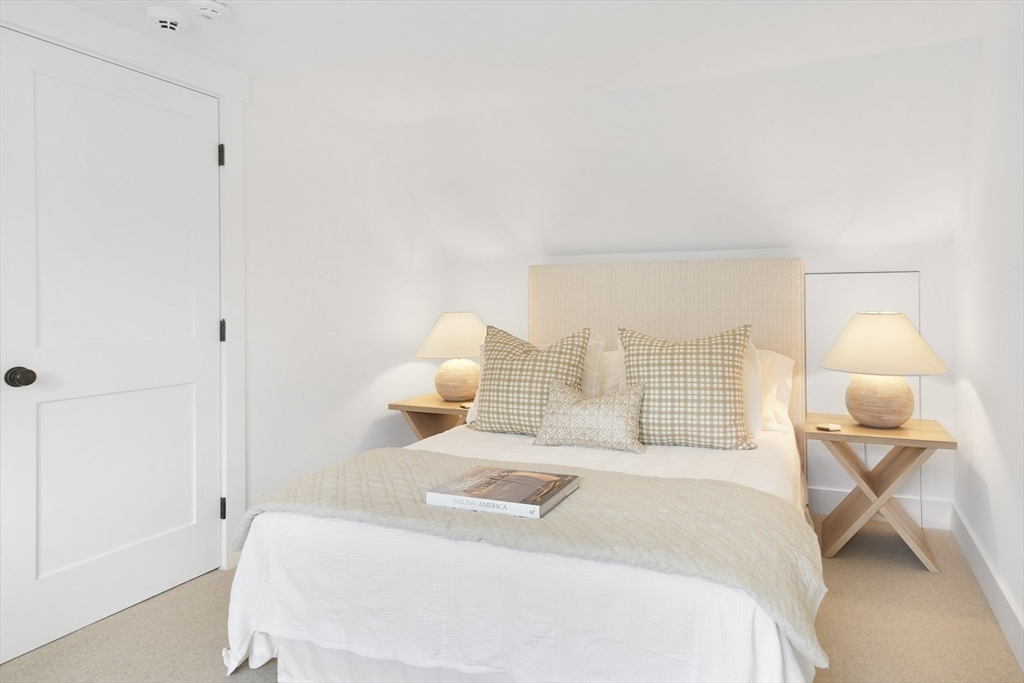 37 Rd To The Plaines Edgartown, MA 02539 - Photo 34 of 42 a bedroom with a bed and a lamp