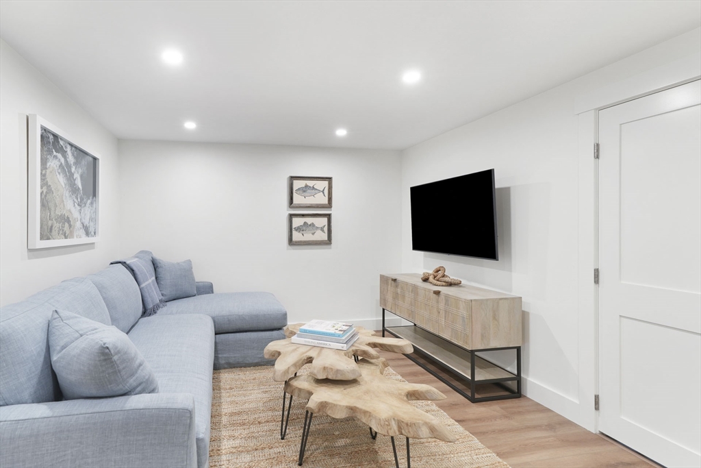 37 Rd To The Plaines Edgartown, MA 02539 - Photo 37 of 42 a living room with furniture and a flat screen tv
