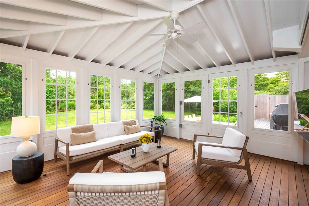 37 Rd To The Plaines Edgartown, MA 02539 - Photo 41 of 42 a living room with furniture a wooden floor and a large window with outer view