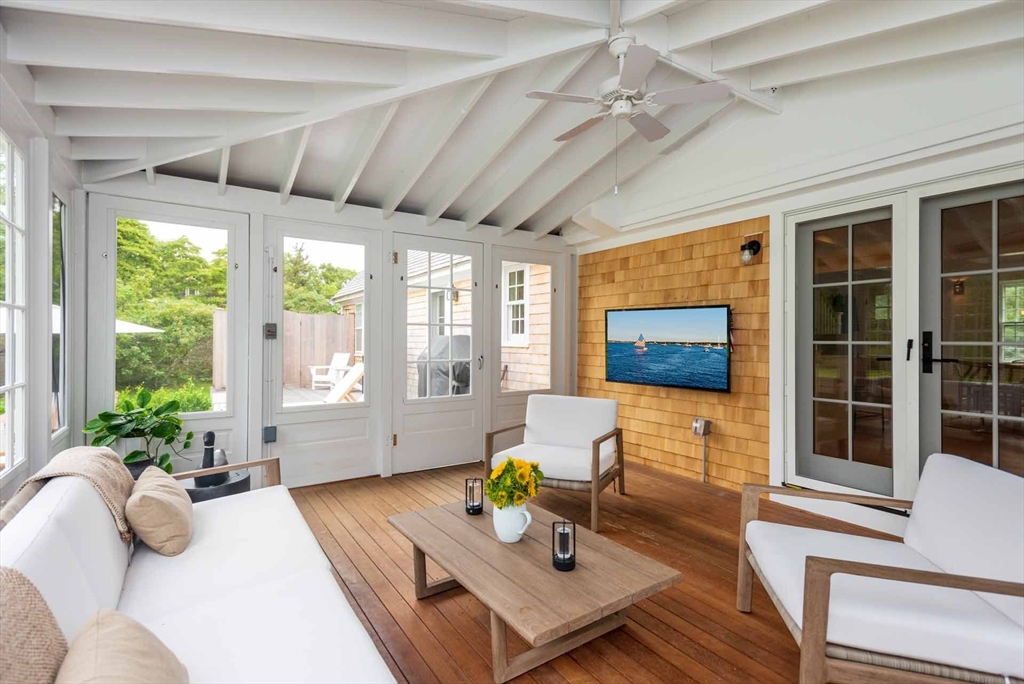 37 Rd To The Plaines Edgartown, MA 02539 - Photo 42 of 42 a living room with furniture a flat screen tv and a large window