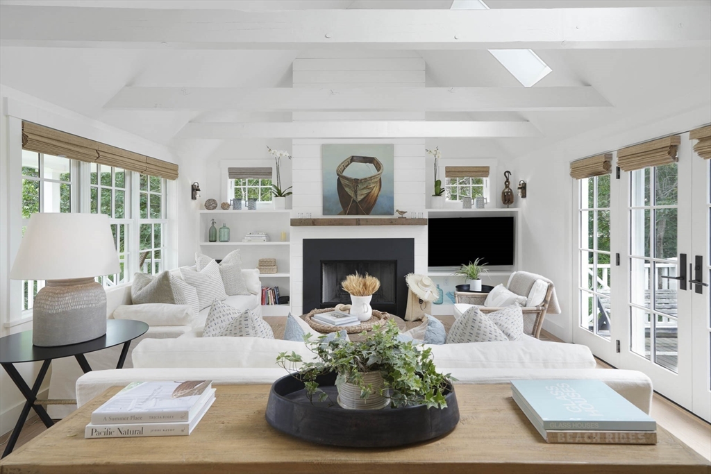 37 Rd To The Plaines Edgartown, MA 02539 - Photo 9 of 42 a living room with furniture and a fireplace