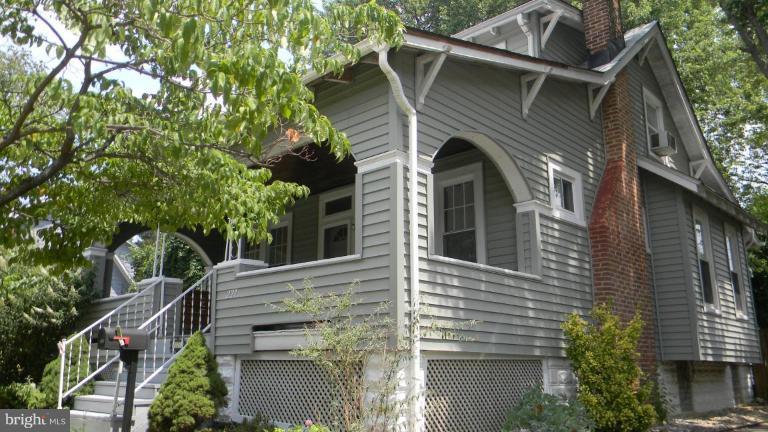 227 Mallow Hill Road Baltimore, MD 21229 - Photo 1 of 11 a view of a house with a tree