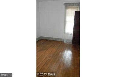 227 Mallow Hill Road Baltimore, MD 21229 - Photo 8 of 11 a view of a room with a bench