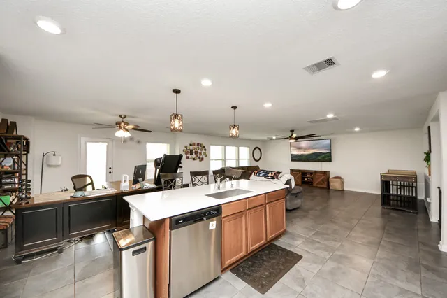 a kitchen with a sink a counter top space and appliances