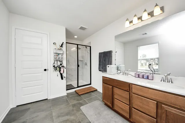 a room with a sink and a mirror