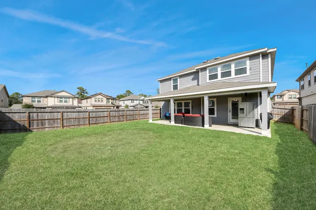 a backyard of a house with seating space