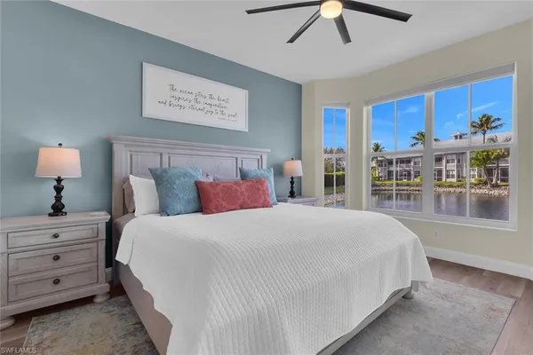 a bedroom with a large bed and a window