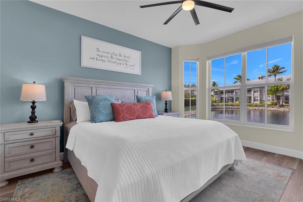 7880 Mahogany Run Lane, Unit 1614 Naples, FL 34113 - Photo 12 of 38 a bedroom with a large bed and a window