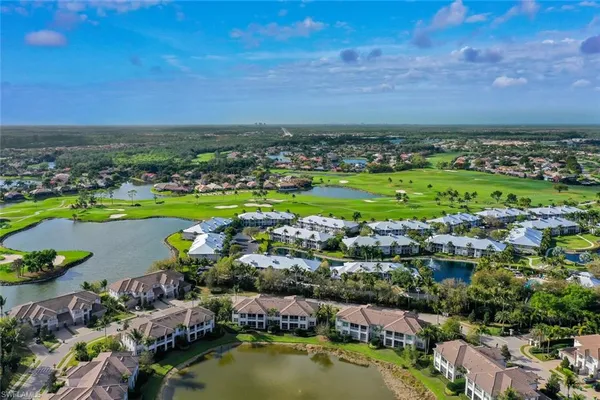 a view of a city with lots of residential buildings and ocean view