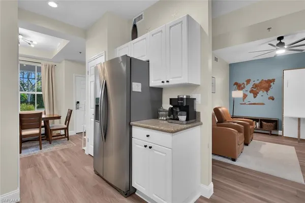a kitchen with stainless steel appliances a stove a refrigerator and a refrigerator