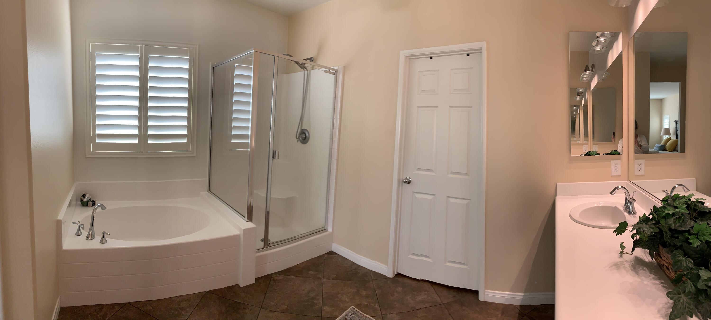 82515 Grass Flat Lane Indio, CA 92203 - Photo 15 of 44 a bathroom with a bathtub and shower