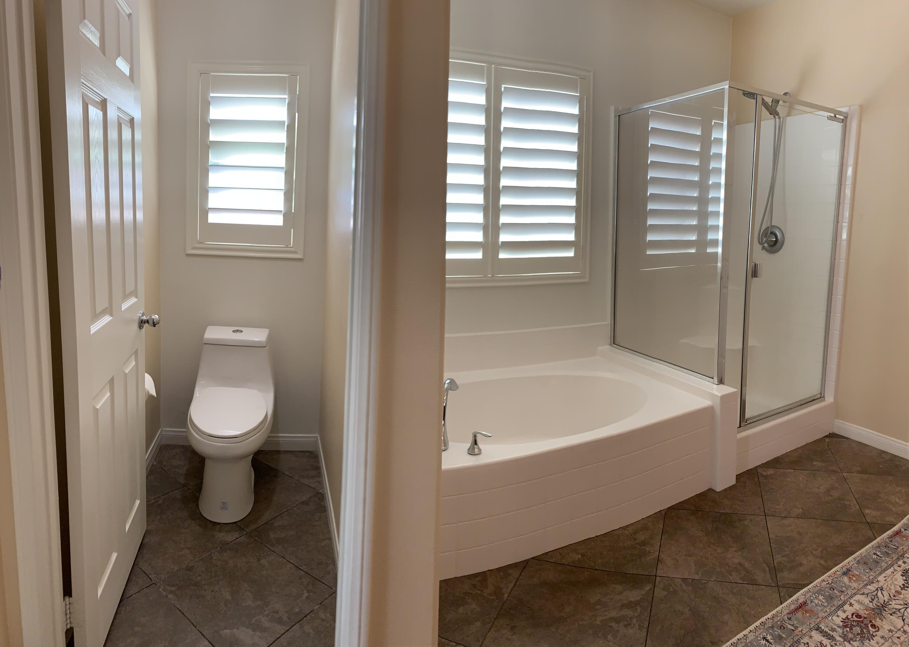 82515 Grass Flat Lane Indio, CA 92203 - Photo 16 of 44 a bathroom with a toilet and a shower