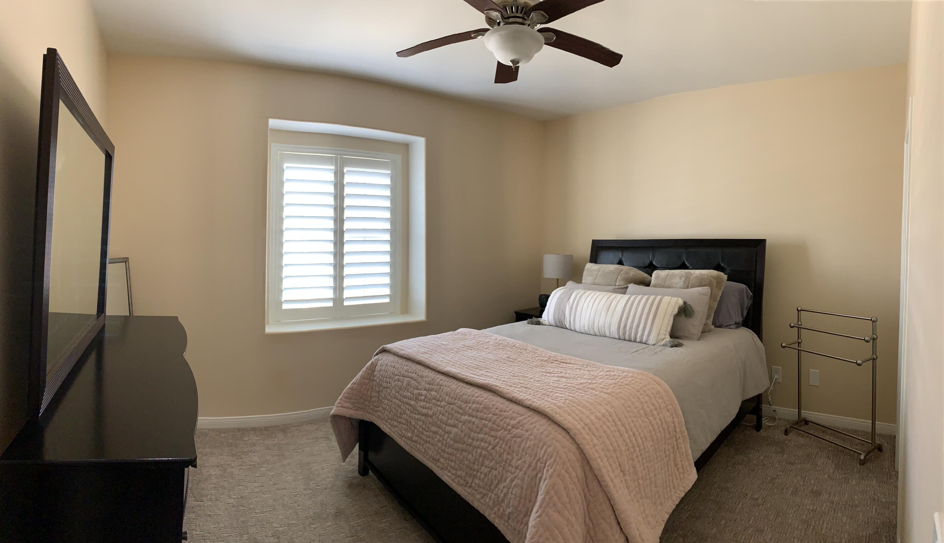 82515 Grass Flat Lane Indio, CA 92203 - Photo 17 of 44 a bedroom with a bed and a window