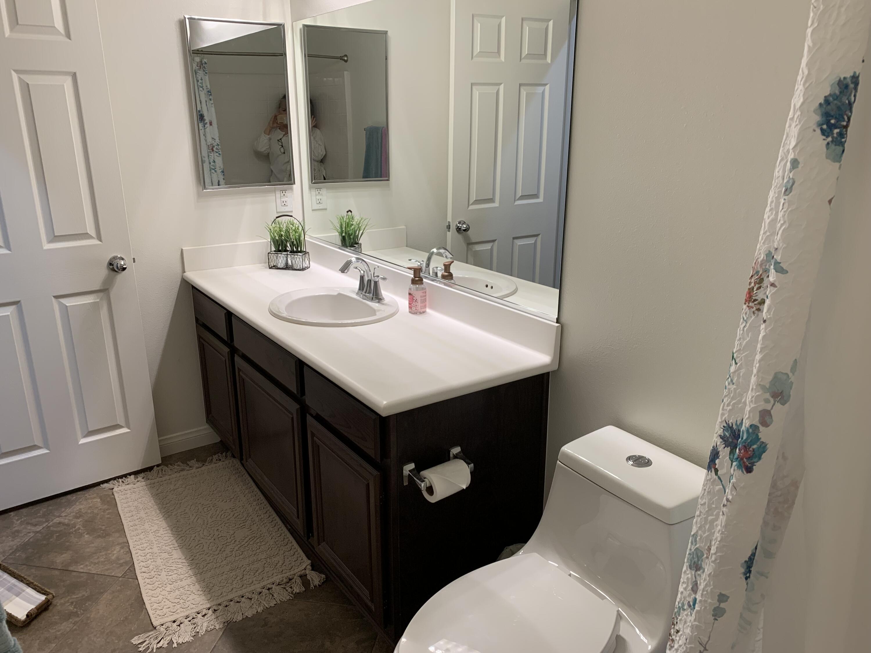 82515 Grass Flat Lane Indio, CA 92203 - Photo 20 of 44 a bathroom with a sink toilet and mirror