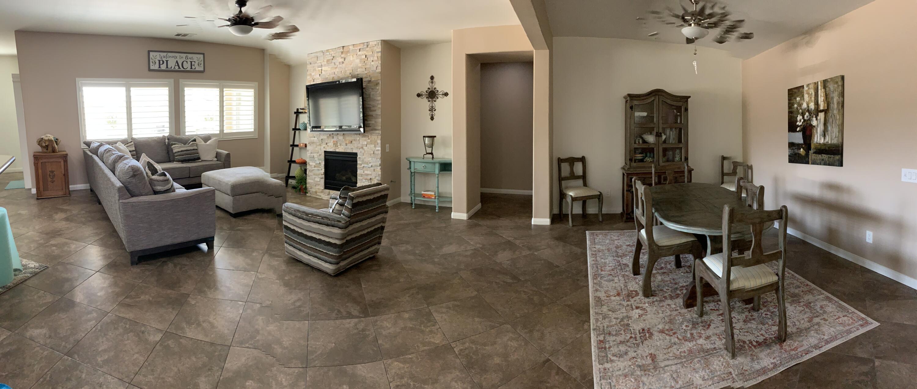 82515 Grass Flat Lane Indio, CA 92203 - Photo 2 of 44 a living room with furniture and a fireplace