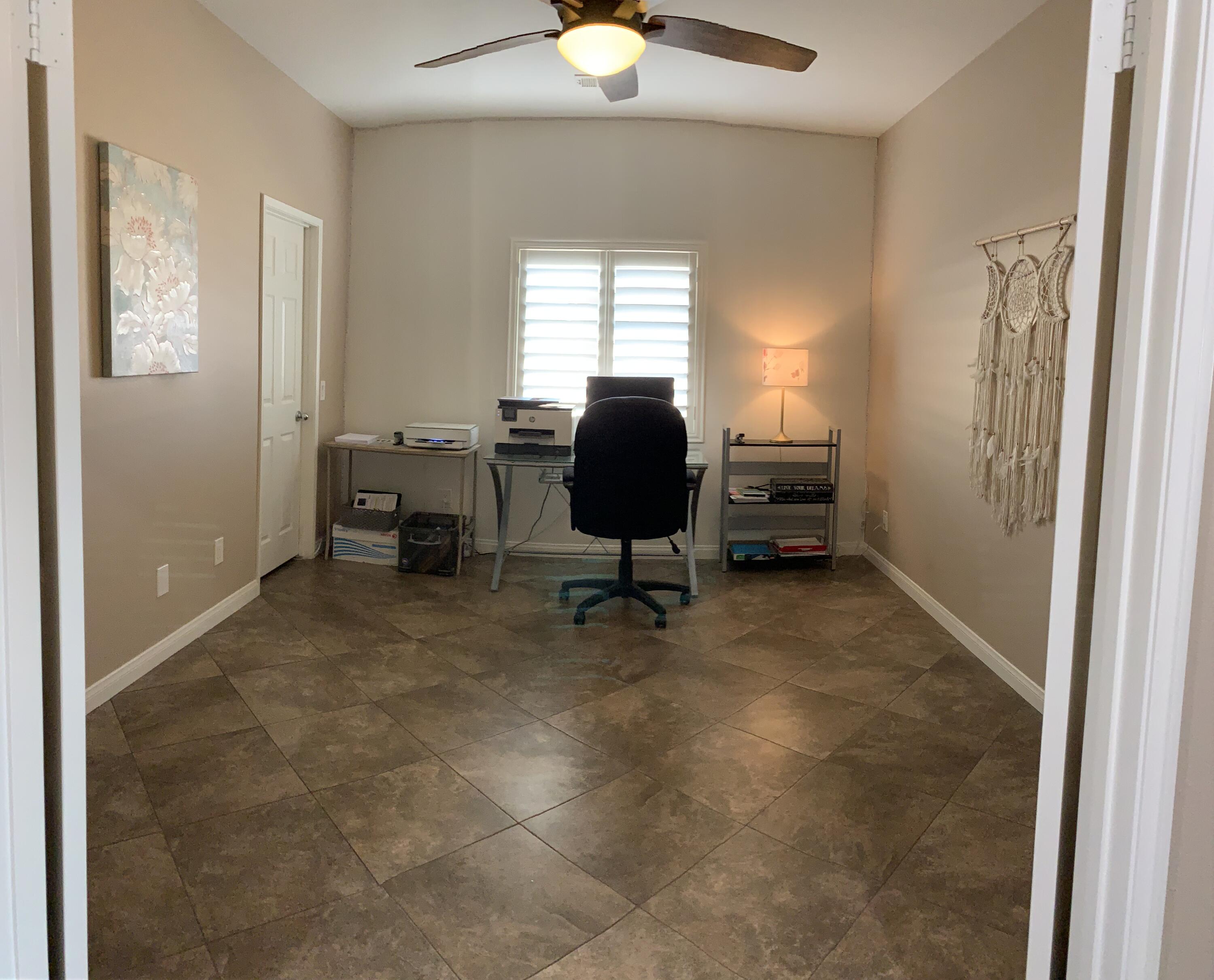 82515 Grass Flat Lane Indio, CA 92203 - Photo 24 of 44 a workspace with furniture and a window