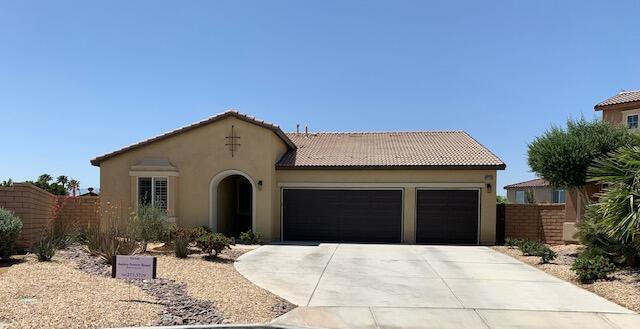 82515 Grass Flat Lane Indio, CA 92203 - Photo 26 of 44 a view of a house with a yard