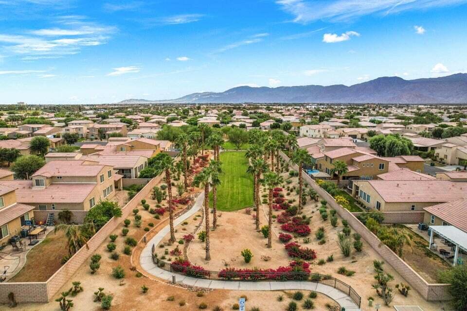 82515 Grass Flat Lane Indio, CA 92203 - Photo 30 of 44 an aerial view of residential houses with outdoor space