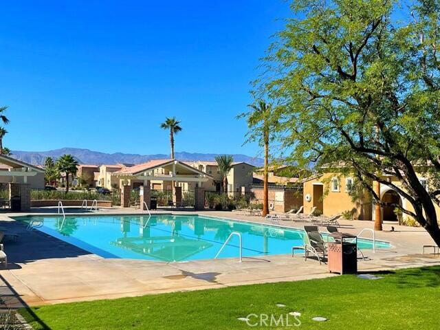 82515 Grass Flat Lane Indio, CA 92203 - Photo 34 of 44 a view of a house with a yard
