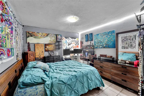 a bed room with a bed and furniture