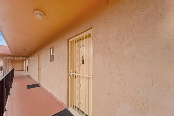 a view of a hallway with a white walls