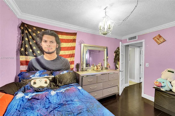 a bed room with furniture and a chandelier