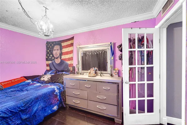 a bed room with a bed and a window