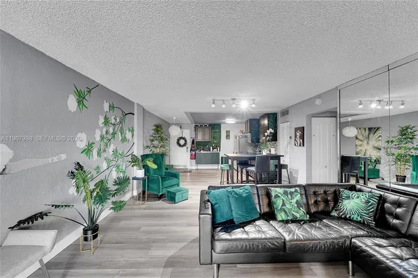 a living room with furniture and a potted plant