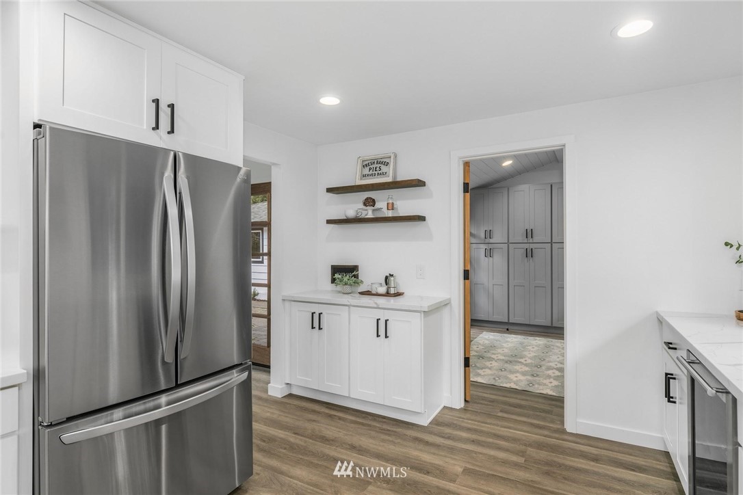 24207 39th Avenue Southeast Bothell, WA 98021 - Photo 15 of 39 a kitchen with stainless steel appliances a refrigerator and a stove top oven