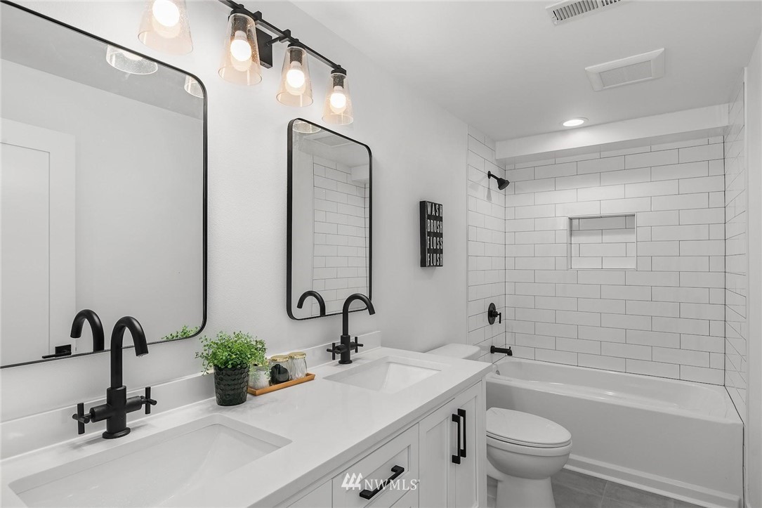 24207 39th Avenue Southeast Bothell, WA 98021 - Photo 24 of 39 a bathroom with a granite countertop sink mirror toilet and bathtub