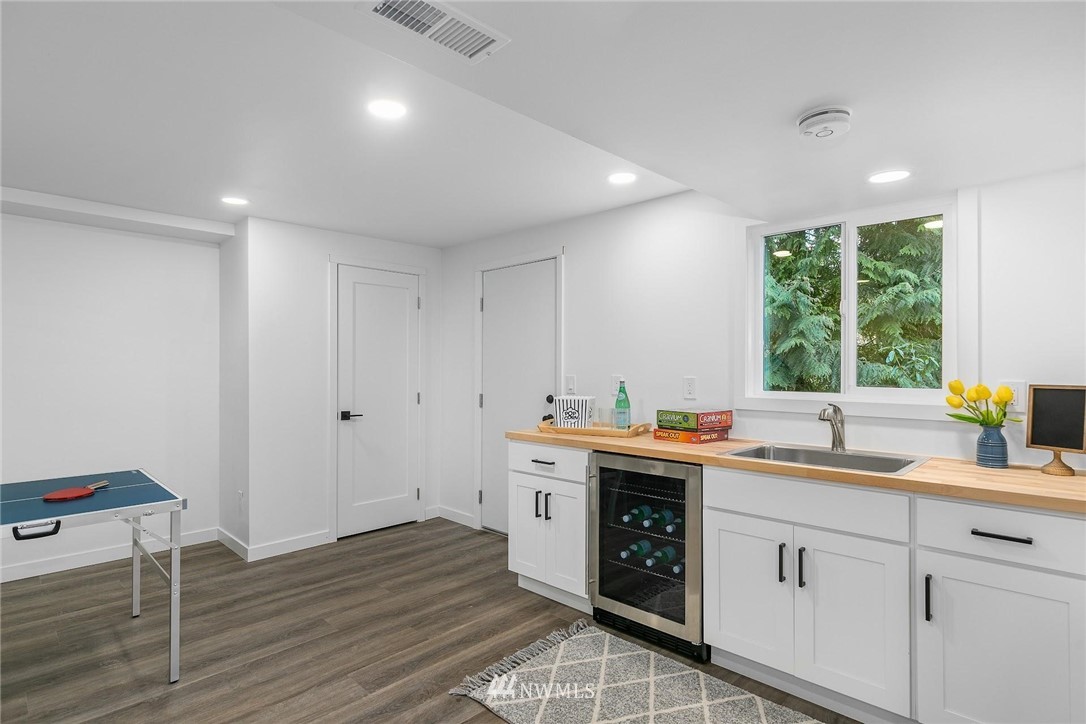 24207 39th Avenue Southeast Bothell, WA 98021 - Photo 29 of 39 a kitchen with a sink stove and cabinets