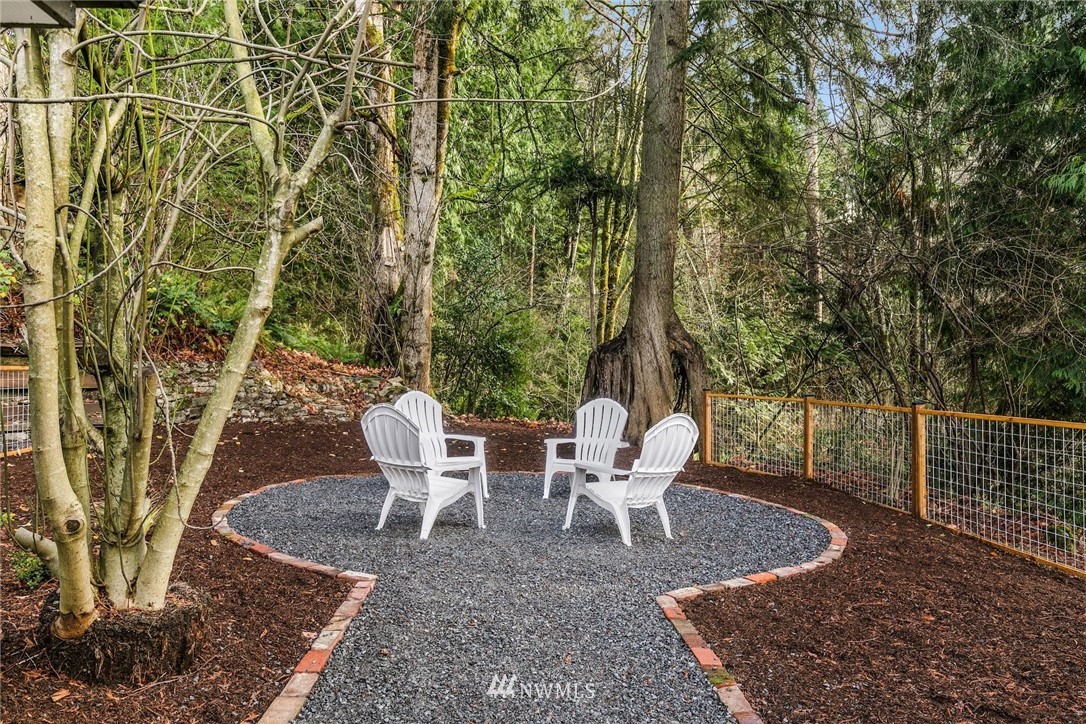 24207 39th Avenue Southeast Bothell, WA 98021 - Photo 32 of 39 a view of a chairs and table in backyard