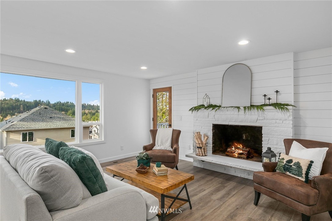 24207 39th Avenue Southeast Bothell, WA 98021 - Photo 7 of 39 a living room with furniture fireplace and window