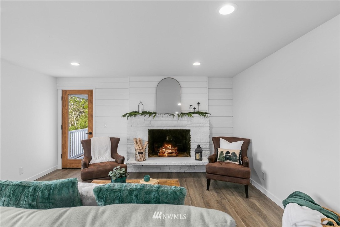 24207 39th Avenue Southeast Bothell, WA 98021 - Photo 8 of 39 a living room with furniture and a fireplace