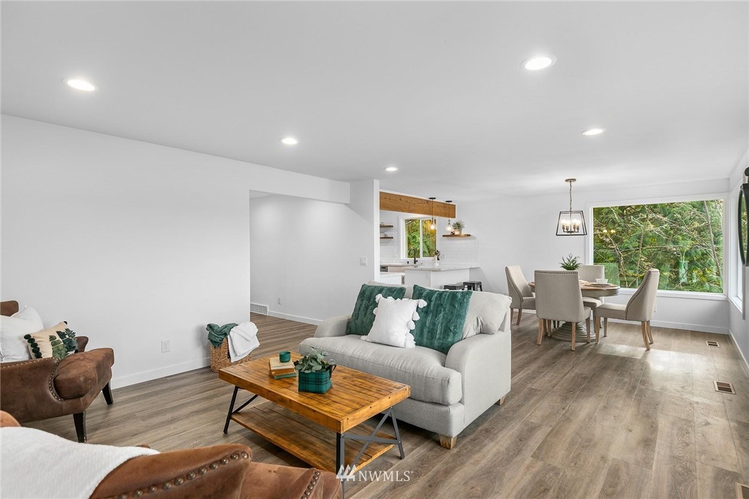 24207 39th Avenue Southeast Bothell, WA 98021 - Photo 9 of 39 a living room with furniture and a wooden floor