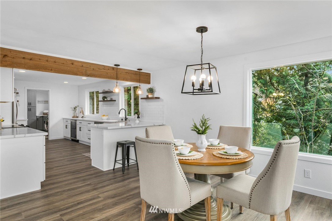 24207 39th Avenue Southeast Bothell, WA 98021 - Photo 10 of 39 a view of a dining room with furniture window and wooden floor