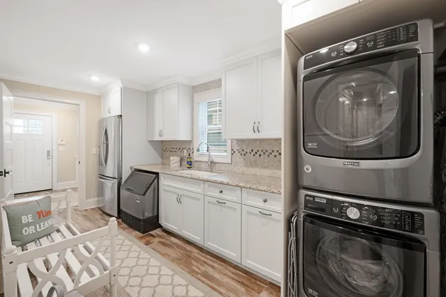 a kitchen with a washer and dryer