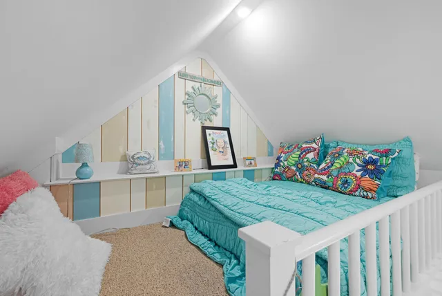 a bed room with two beds and a baby crib